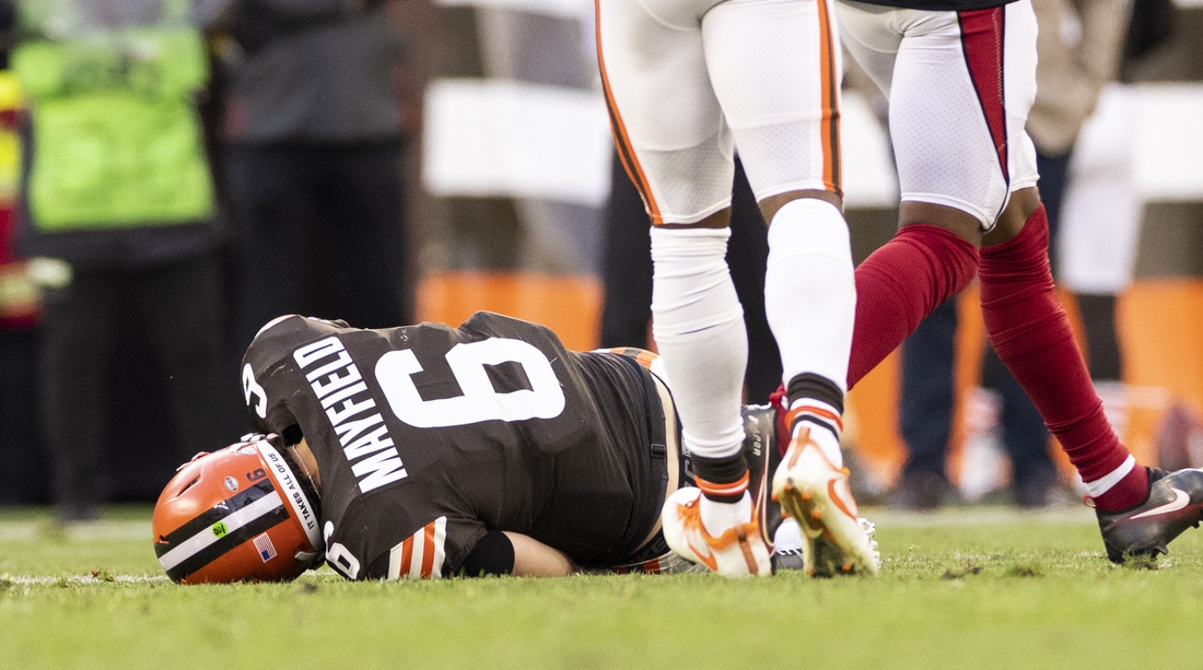 Oct 17, 2021; Cleveland, Ohio, USA; Cleveland Browns quarterback Baker Mayfield (6) lays on the ground from an injury during the third quarter against the Arizona Cardinals at FirstEnergy Stadium. Mandatory Credit: Scott Galvin-USA TODAY Sports