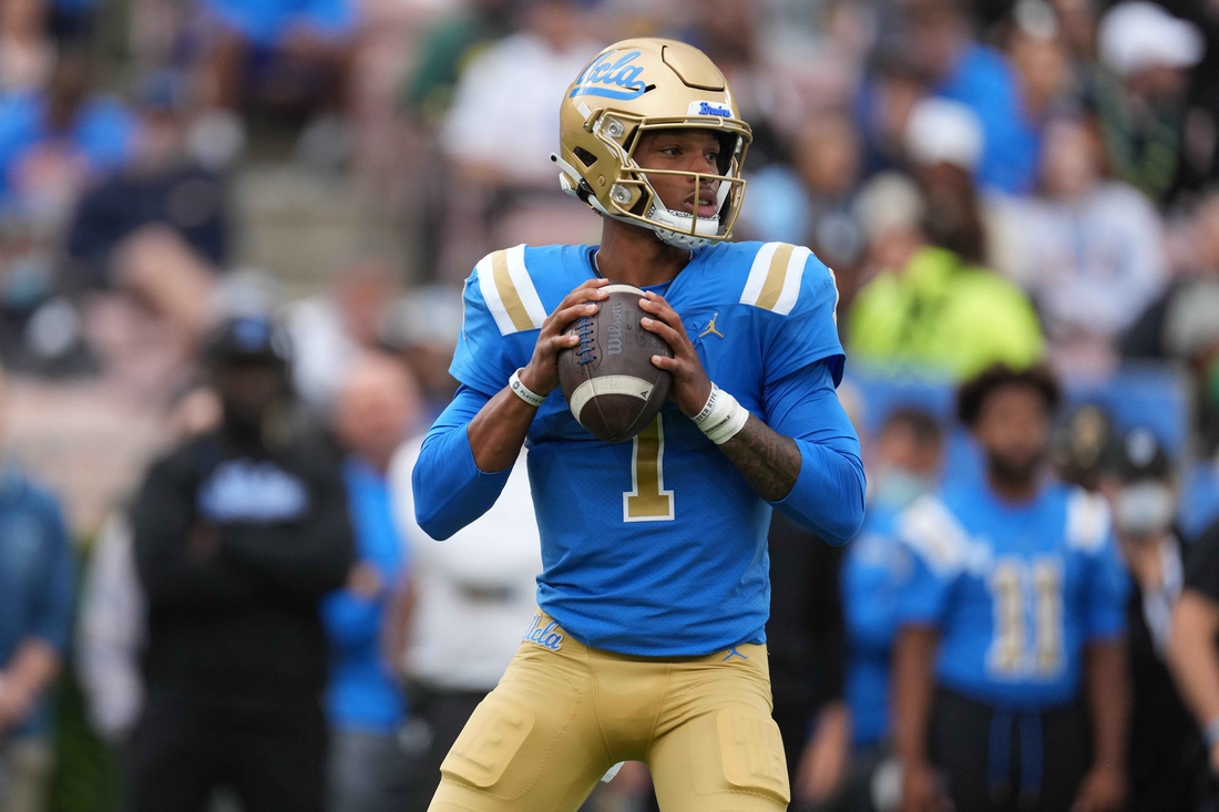 Oct 23, 2021; Pasadena, California, USA; UCLA Bruins quarterback Dorian Thompson-Robinson (1) throws the ball against the Oregon Ducks  in the first half at Rose Bowl. Mandatory Credit: Kirby Lee-USA TODAY Sports