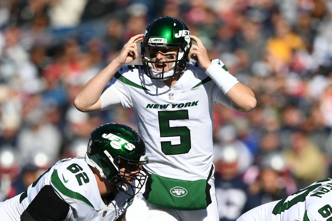 Oct 24, 2021; Foxborough, Massachusetts, USA; New York Jets quarterback Mike White (5) calls a play against the New England Patriots during the first half at Gillette Stadium. Mandatory Credit: Brian Fluharty-USA TODAY Sports