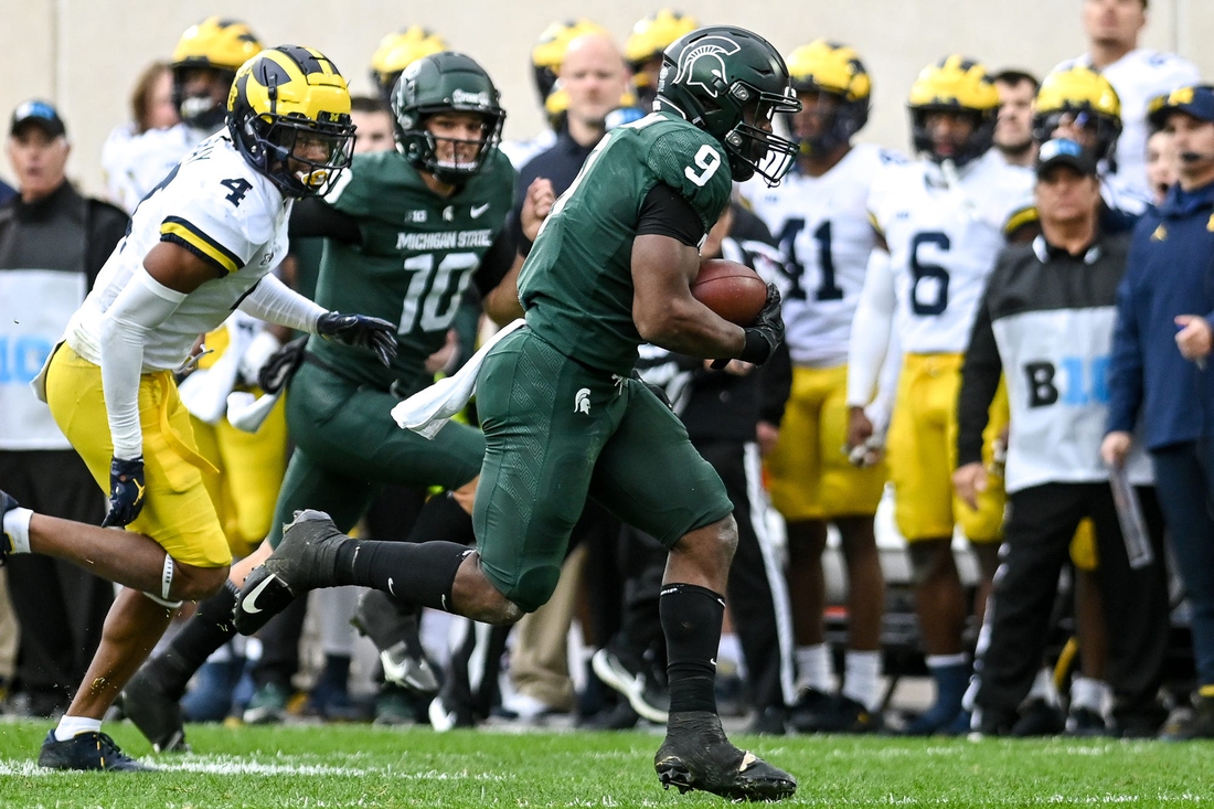 Michigan State's Kenneth Walker III, right, runs for a touchdown as Michigan's Vincent Gray trails behind during the second quarter on Saturday, Oct. 30, 2021, at Spartan Stadium in East Lansing.

211030 Msu Michigan 084a
