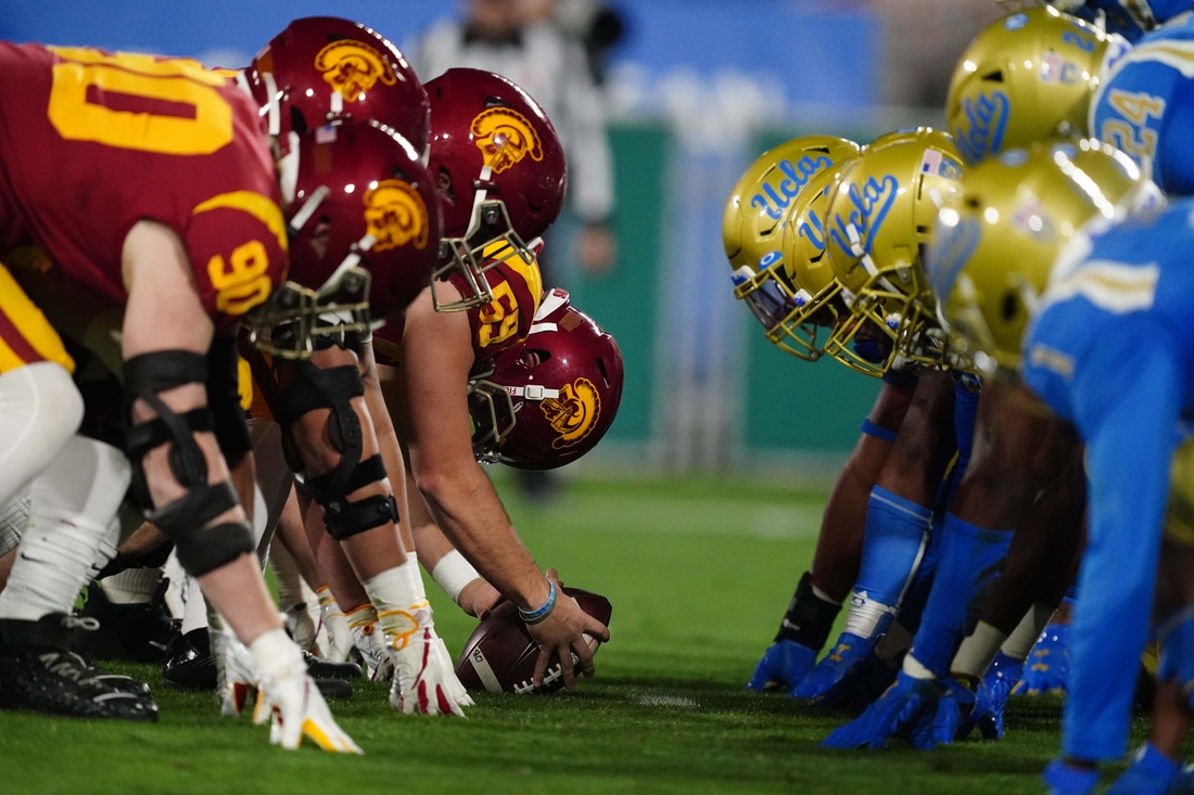 Dec 12, 2020; Pasadena, California, USA; General view of the line of scrimmage as Southern California Trojans offensive lineman Damon Johnson (59) snaps the ball against the UCLA Bruins  at Rose Bowl. USC defeated UCLA 43-38.  Mandatory Credit: Kirby Lee-USA TODAY Sports