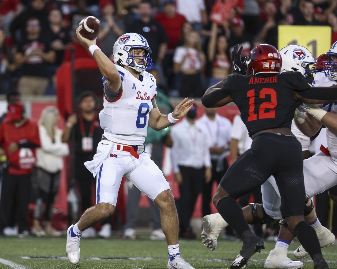 Oct 30, 2021; Houston, Texas, USA; Southern Methodist Mustangs quarterback Tanner Mordecai (8) attempts a pass during the first quarter against the Houston Cougars at TDECU Stadium. Mandatory Credit: Troy Taormina-USA TODAY Sports