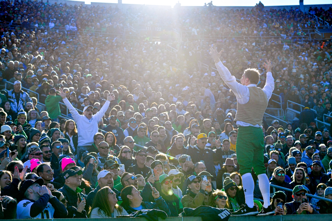 Nov 6, 2021; South Bend, Indiana, USA; The Notre Dame Leprechaun exhorts the crowd in the first quarter of the game between the Notre Dame Fighting Irish and the Navy Midshipmen at Notre Dame Stadium. Mandatory Credit: Matt Cashore-USA TODAY Sports