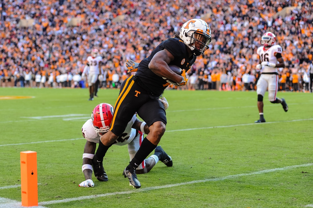 Nov 13, 2021; Knoxville, Tennessee, USA; Tennessee Volunteers wide receiver Velus Jones Jr. (1) runs past Georgia Bulldogs defensive back Latavious Brini (36) for a touchdown during the first quarter at Neyland Stadium. Mandatory Credit: Bryan Lynn-USA TODAY Sports