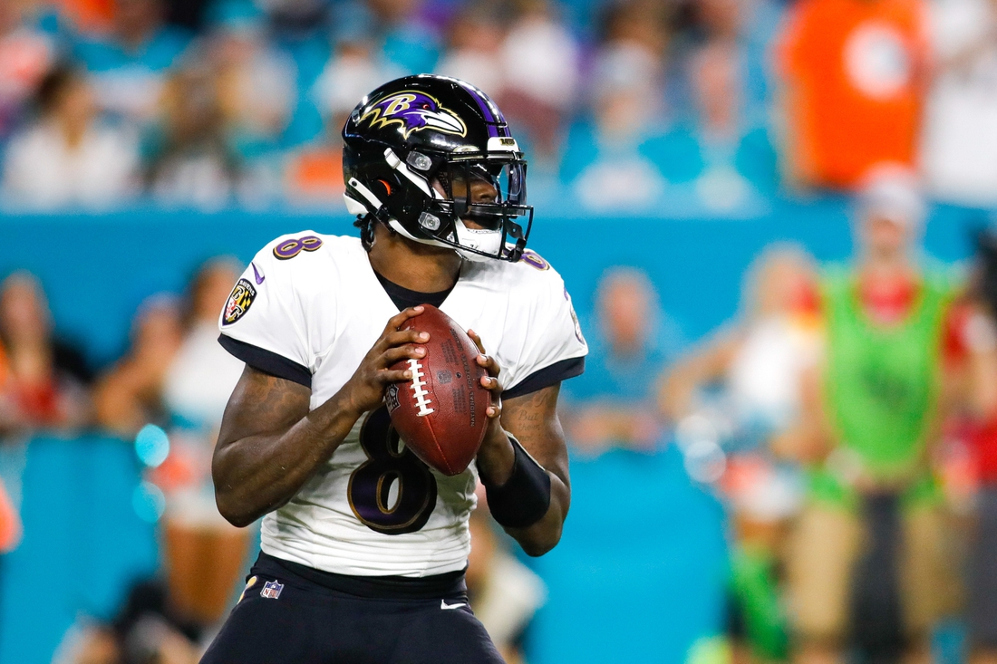 Nov 11, 2021; Miami Gardens, Florida, USA; Baltimore Ravens quarterback Lamar Jackson (8) look on before throwing the football against the Miami Dolphins during the second quarter of the game at Hard Rock Stadium. Mandatory Credit: Sam Navarro-USA TODAY Sports