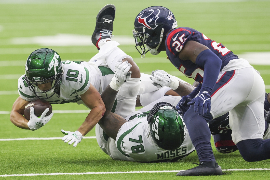 Nov 28, 2021; Houston, Texas, USA; New York Jets wide receiver Braxton Berrios (10) dives as he is tackled by the Houston Texans in the second quarter at NRG Stadium. Mandatory Credit: Thomas Shea-USA TODAY Sports