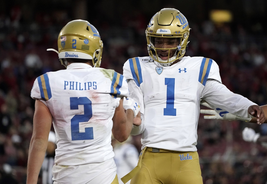 Oct 17, 2019; Stanford, CA, USA; UCLA Bruins quarterback Dorian Thompson-Robinson (1) and wide receiver Kyle Philips (2) celebrate after a touchdown in the first half against the Stanford Cardinal at Stanford Stadium. Mandatory Credit: Kirby Lee-USA TODAY Sports