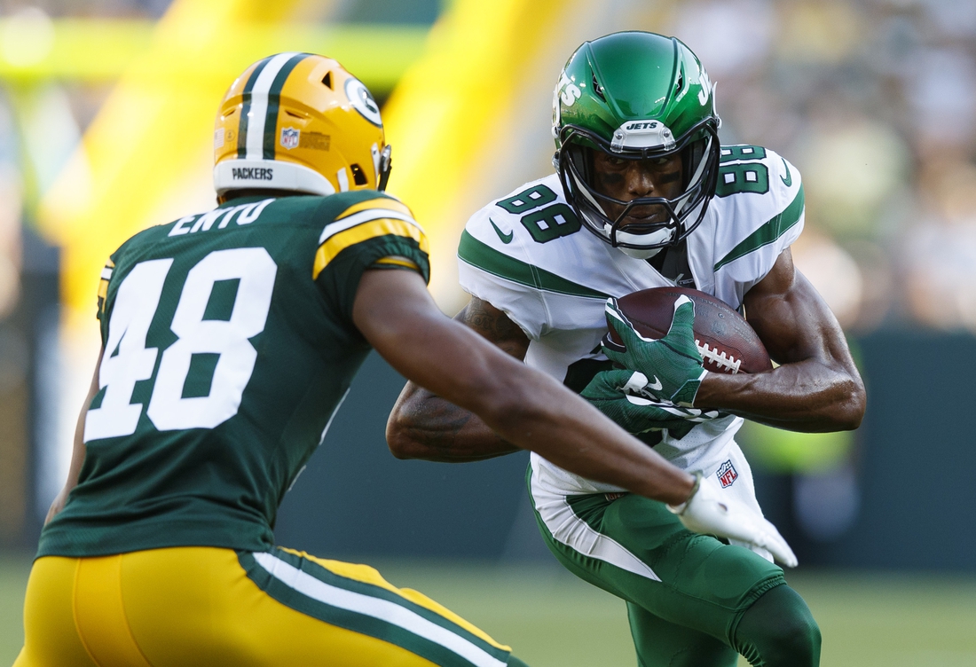 Aug 21, 2021; Green Bay, Wisconsin, USA;  New York Jets wide receiver Keelan Cole (88) rushes with the fooball as Green Bay Packers cornerback Kabion Ento (48) defends during the third quarter at Lambeau Field. Mandatory Credit: Jeff Hanisch-USA TODAY Sports