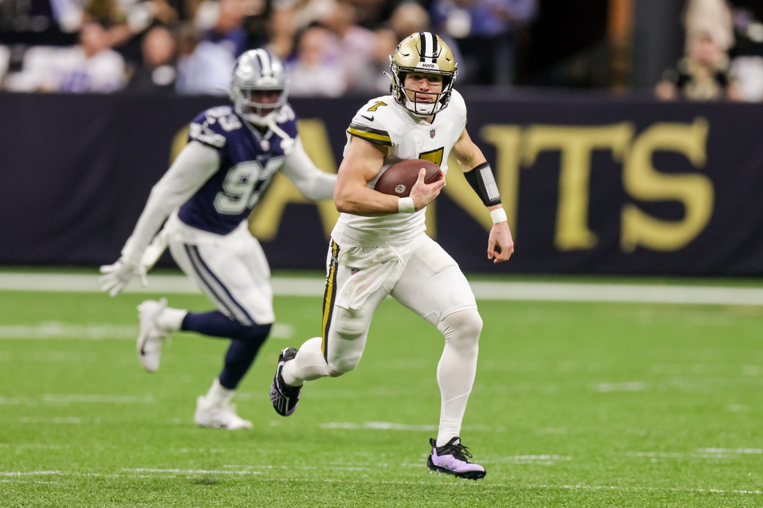 Dec 2, 2021; New Orleans, Louisiana, USA; New Orleans Saints quarterback Taysom Hill (7) against Dallas Cowboys defensive end Tarell Basham (93) during the first half at Caesars Superdome. Mandatory Credit: Stephen Lew-USA TODAY Sports