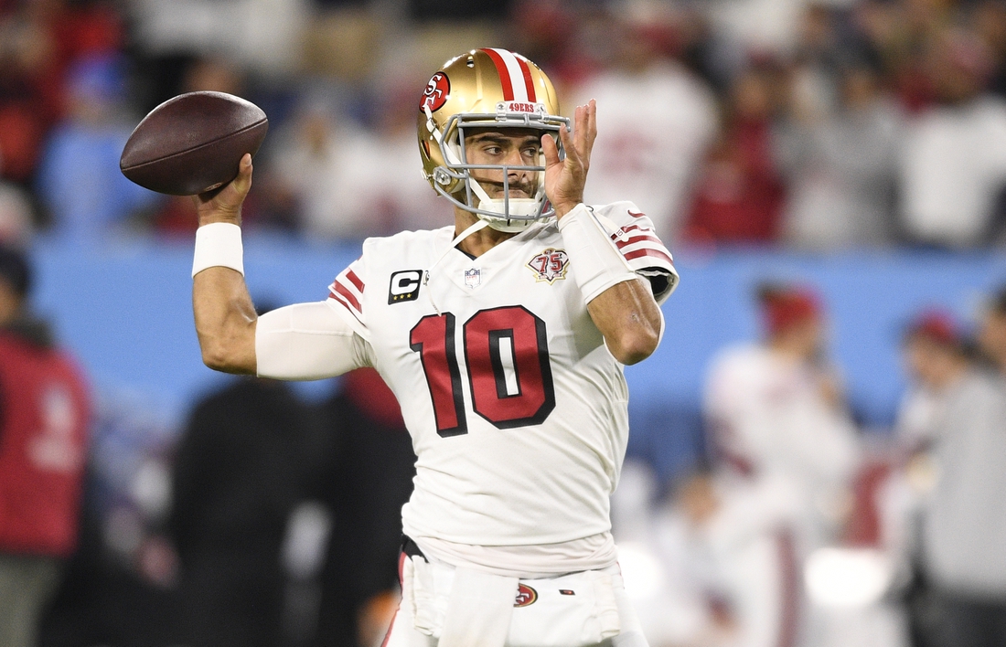 Dec 23, 2021; Nashville, Tennessee, USA;  San Francisco 49ers quarterback Jimmy Garoppolo (10) throws a pass during pre-game warmups before their game against the Tennessee Titans at Nissan Stadium. Mandatory Credit: Steve Roberts-USA TODAY Sports