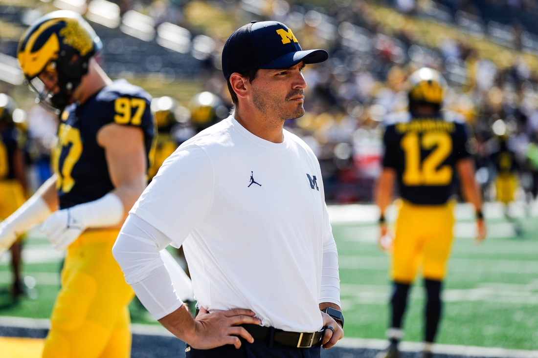 Michigan defensive coordinator Mike Macdonald watches warmups before a game against Northern Illinois at Michigan Stadium in Ann Arbor on Saturday, Sept. 18, 2021.