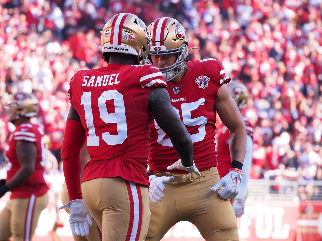 Nov 28, 2021; Santa Clara, California, USA; San Francisco 49ers wide receiver Deebo Samuel (19) celebrates with tight end George Kittle (85) after scoring a touchdown against the Minnesota Vikings during the first quarter at Levi's Stadium. Mandatory Credit: Kelley L Cox-USA TODAY Sports