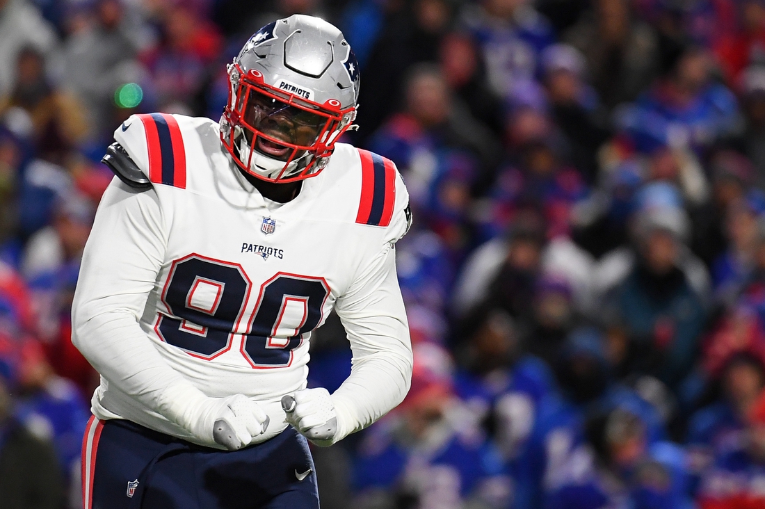 Dec 6, 2021; Orchard Park, New York, USA; New England Patriots defensive end Christian Barmore (90) reacts to a defensive play against the Buffalo Bills during the first half at Highmark Stadium. Mandatory Credit: Rich Barnes-USA TODAY Sports