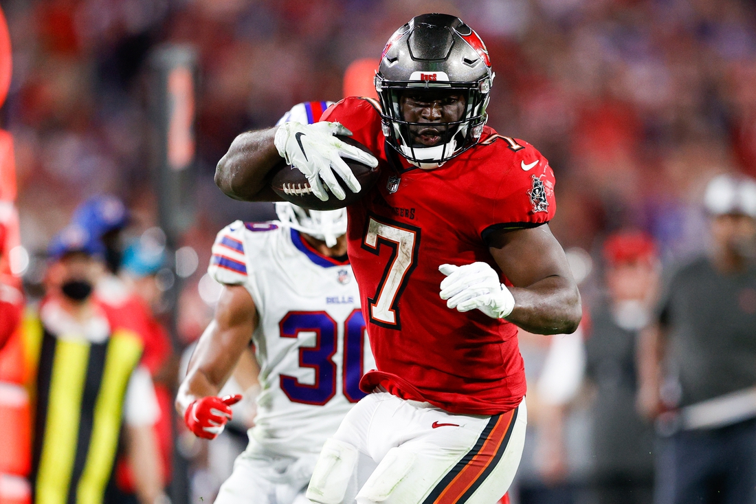 Dec 12, 2021; Tampa, Florida, USA;  Tampa Bay Buccaneers running back Leonard Fournette (7) runs with the ball in the second half against the Buffalo Bills at Raymond James Stadium. Mandatory Credit: Nathan Ray Seebeck-USA TODAY Sports