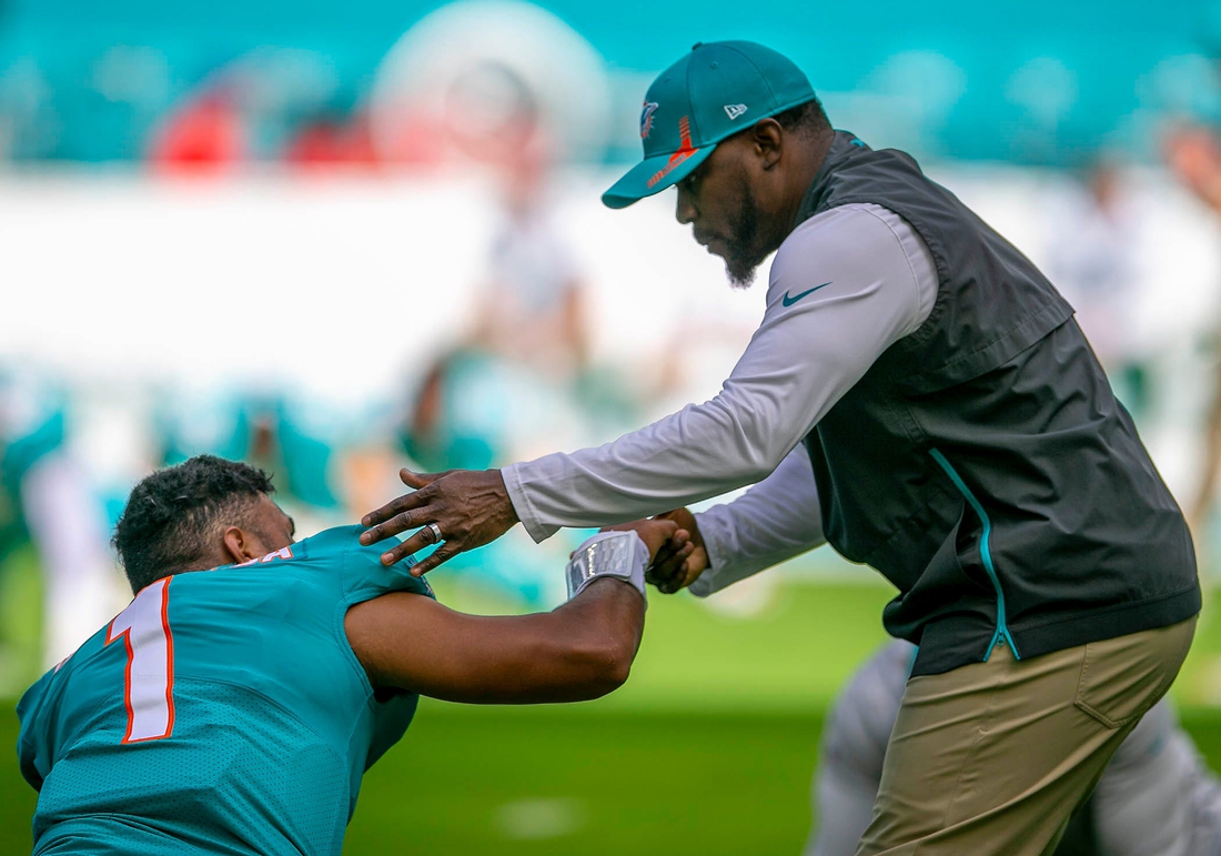 Miami Dolphins head coach Brian Flores, shakes hands withMiami Dolphins quarterback Tua Tagovailoa (1) before the start of the game against the New York Jets during NFL game at Hard Rock Stadium Sunday in Miami Gardens.

New York Jet V Miami Dolphins 09