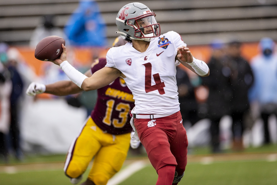 Dec 31, 2021; El Paso, Texas, USA; Washington State Cougars quarterback Jayden de Laura (4) drops back to pass the ball against the Central Michigan Chippewas defense in the 88th annual Sun Bowl football game at Sun Bowl Stadium. Mandatory Credit: Ivan Pierre Aguirre-USA TODAY Sports