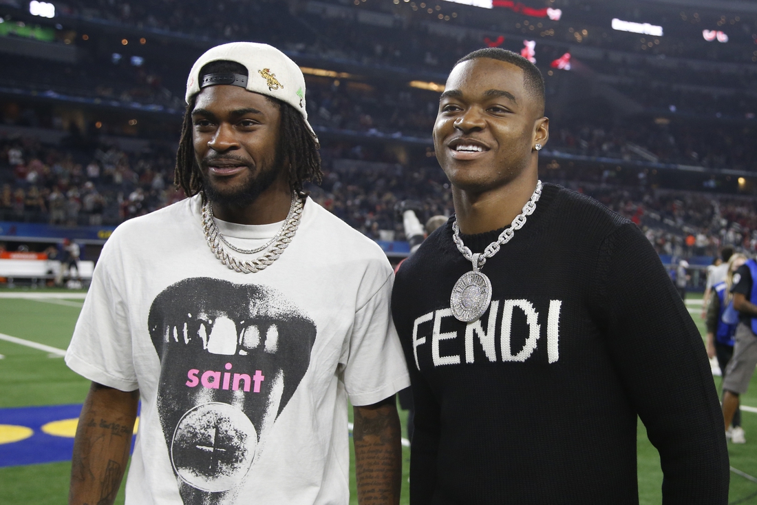 Dec 31, 2021; Arlington, Texas, USA; Dallas Cowboys Trevon Diggs (L) and Amari Cooper (R) pose on the field after the game against the Cincinnati Bearcats at the 2021 Cotton Bowl college football CFP national semifinal game at AT&T Stadium. Mandatory Credit: Tim Heitman-USA TODAY Sports