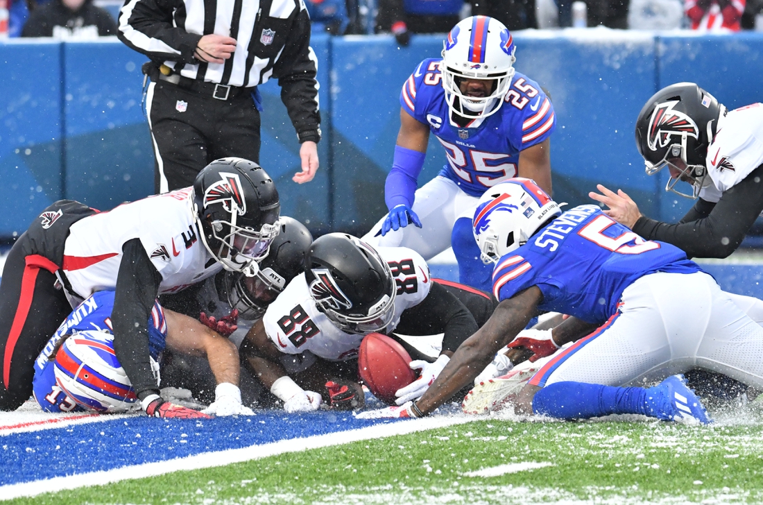 Jan 2, 2022; Orchard Park, New York, USA; Atlanta Falcons wide receiver Frank Darby (88) and teammates struggle to recover a fumble by Buffalo Bills wide receiver Marquez Stevenson (5) on a punt for a safety in the first quarter at Highmark Stadium. Mandatory Credit: Mark Konezny-USA TODAY Sports