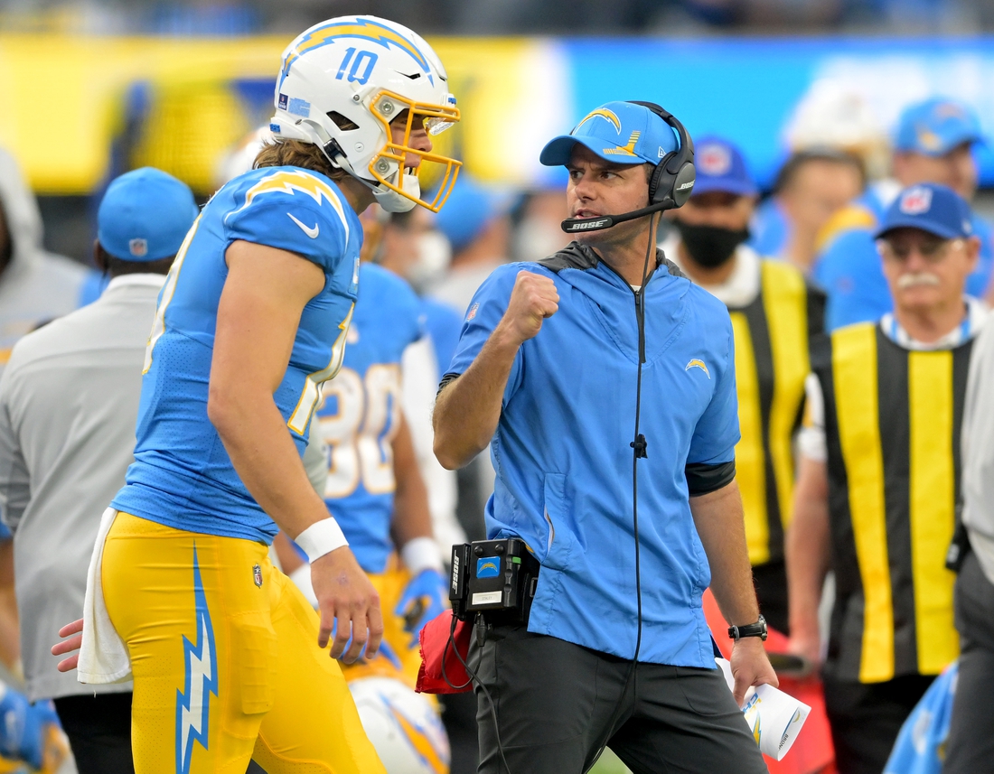 Jan 2, 2022; Inglewood, California, USA; Los Angeles Chargers head coach Brandon Staley celebrates with Los Angeles Chargers quarterback Justin Herbert (10) after a touchdown in the second half the game against the Denver Broncos at SoFi Stadium. Mandatory Credit: Jayne Kamin-Oncea-USA TODAY Sports