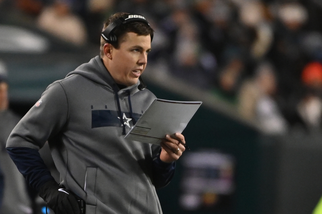 Jan 8, 2022; Philadelphia, Pennsylvania, USA; Dallas Cowboys offensive coordinator Kellen Moore stands on the sidelines against the Philadelphia Eagles during the second quarter at Lincoln Financial Field. Mandatory Credit: Tommy Gilligan-USA TODAY Sports