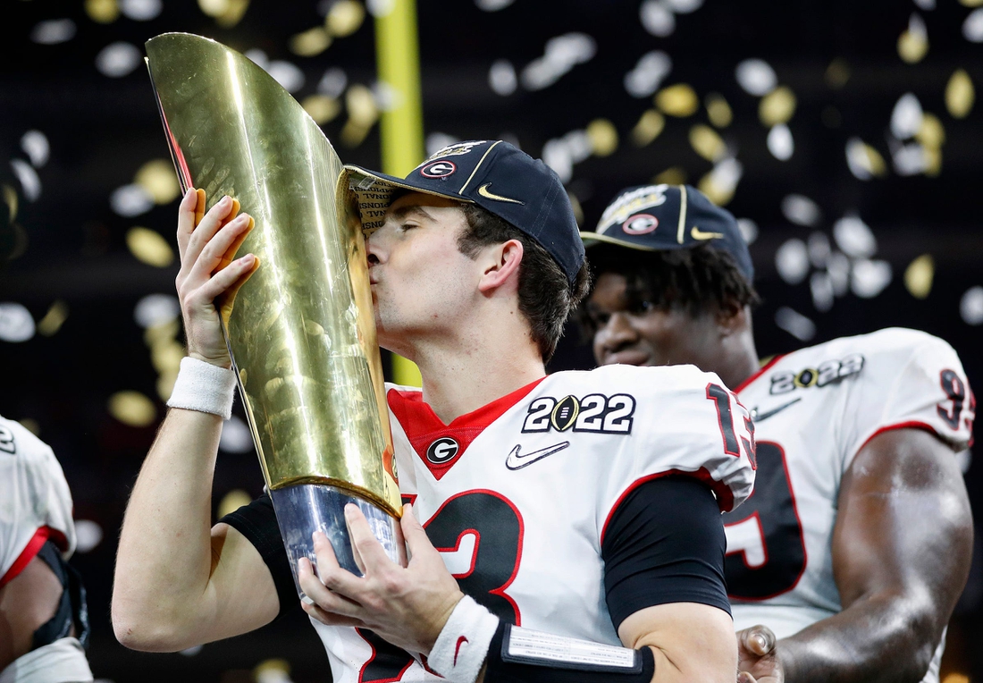 Georgia Bulldogs quarterback Stetson Bennett (13) kisses the trophy after winning the College Football Playoff National Championship on Monday, Jan. 10, 2022, at Lucas Oil Stadium in Indianapolis.

Alabama Crimson Tide Versus Georgia Bulldogs On Monday Jan 10 2022 College Football Playoff National Championship At Lucas Oil Stadium In Indianapolis

Syndication The Indianapolis Star