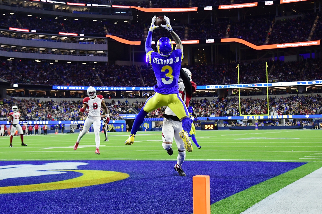 Jan 17, 2022; Inglewood, California, USA; Los Angeles Rams wide receiver Odell Beckham Jr. (3) catches a touchdown pass against Arizona Cardinals cornerback Marco Wilson (20) during the first half in the NFC Wild Card playoff football game at SoFi Stadium. Mandatory Credit: Gary A. Vasquez-USA TODAY Sports