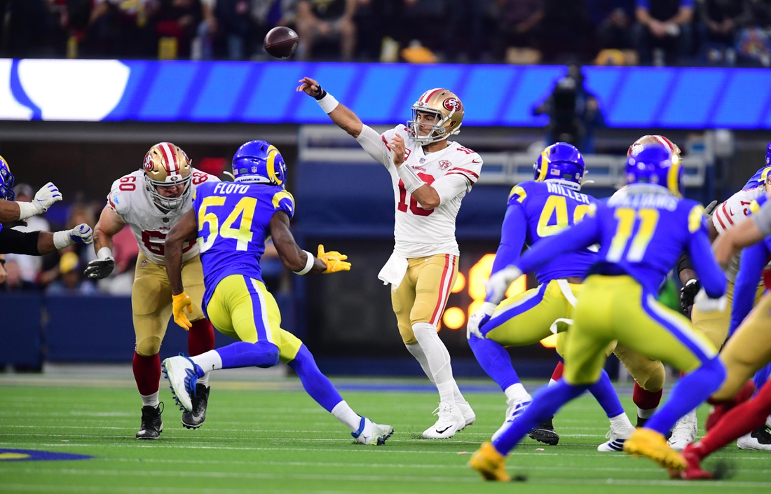 Jan 30, 2022; Inglewood, California, USA; San Francisco 49ers quarterback Jimmy Garoppolo (10) throws a pass against the Los Angeles Rams in the first half during the NFC Championship Game at SoFi Stadium. Mandatory Credit: Gary A. Vasquez-USA TODAY Sports
