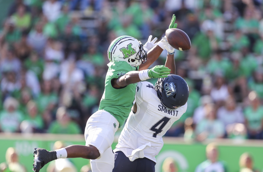 Oct 9, 2021; Huntington, West Virginia, USA; Marshall Thundering Herd defensive back Micah Abraham (6) breaks up a pass intended for Old Dominion Monarchs quarterback Stone Smartt (4) during the third quarter at Joan C. Edwards Stadium. Mandatory Credit: Ben Queen-USA TODAY Sports