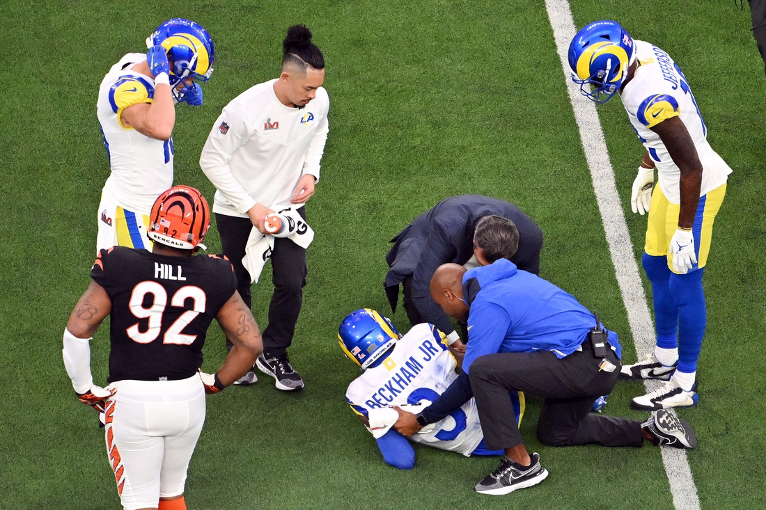 Feb 13, 2022; Inglewood, California, USA; Los Angeles Rams staff attend to wide receiver Odell Beckham Jr. (3) after a play in the second quarter against the Cincinnati Bengals in Super Bowl LVI at SoFi Stadium. Mandatory Credit: Richard Mackson-USA TODAY Sports