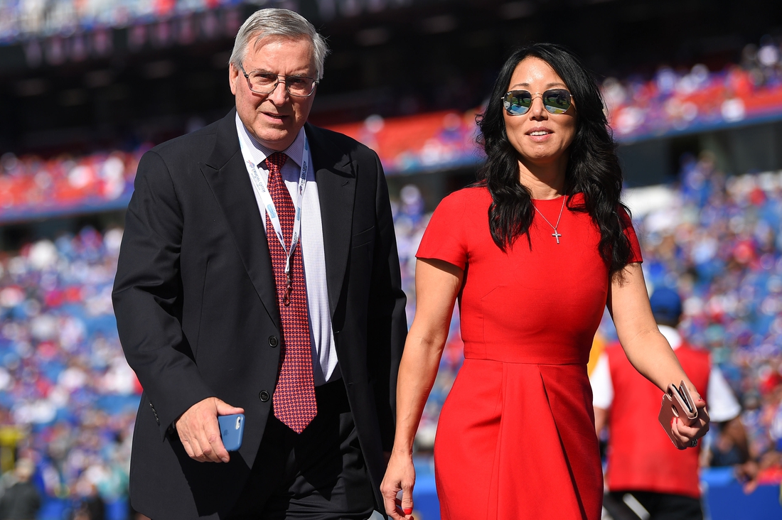 Oct 20, 2019; Orchard Park, NY, USA; Buffalo Bills owners Terry and Kim Pegula walk on the field prior to the game against the Miami Dolphins at New Era Field. Mandatory Credit: Rich Barnes-USA TODAY Sports