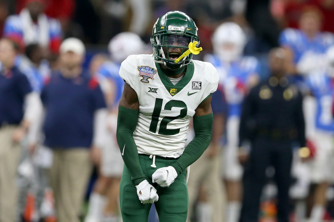 Jan 1, 2022; New Orleans, LA, USA; Baylor Bears cornerback Kalon Barnes (12) reacts to making a play against the Mississippi Rebels in the third quarter of the 2022 Sugar Bowl at the Caesars Superdome. Mandatory Credit: Chuck Cook-USA TODAY Sports