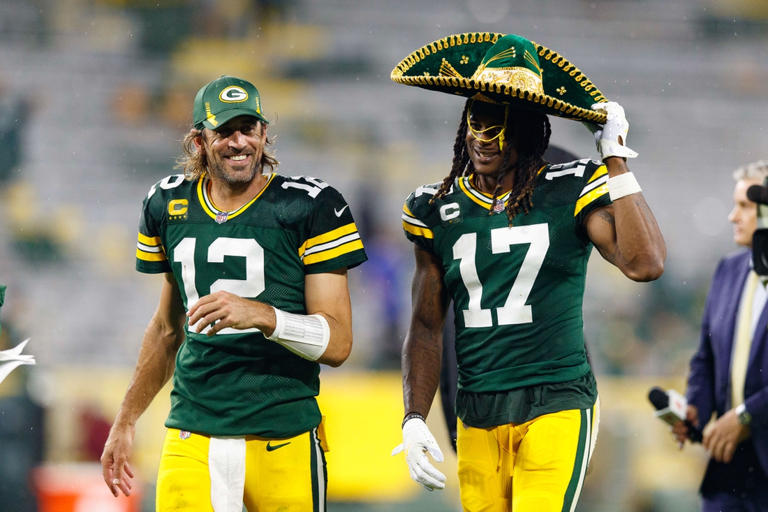 Sep 20, 2021; Green Bay, Wisconsin, USA;  Green Bay Packers quarterback Aaron Rodgers (12) and wide receiver Davante Adams (17) following the game against the Detroit Lions at Lambeau Field. Mandatory Credit: Jeff Hanisch-USA TODAY Sports
