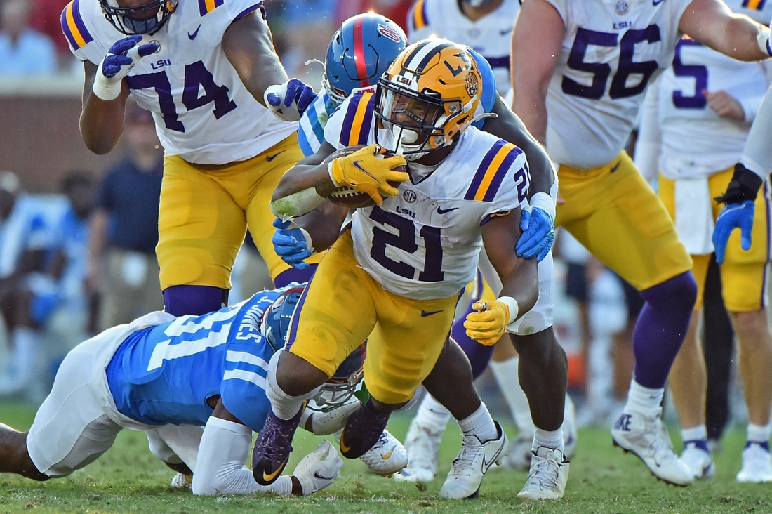 Oct 23, 2021; Oxford, Mississippi, USA; LSU Tigers running back Corey Kiner (21) carries the ball during the second half against the Mississippi Rebels at Vaught-Hemingway Stadium. Mandatory Credit: Justin Ford-USA TODAY Sports