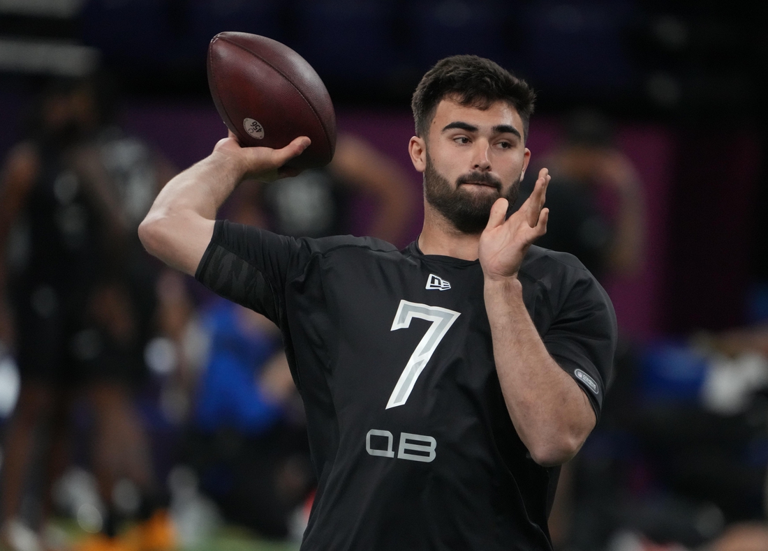 Mar 3, 2022; Indianapolis, IN, USA; North Carolina quarterback Sam Howell (QB07) goes through drills during the 2022 NFL Scouting Combine at Lucas Oil Stadium. Mandatory Credit: Kirby Lee-USA TODAY Sports