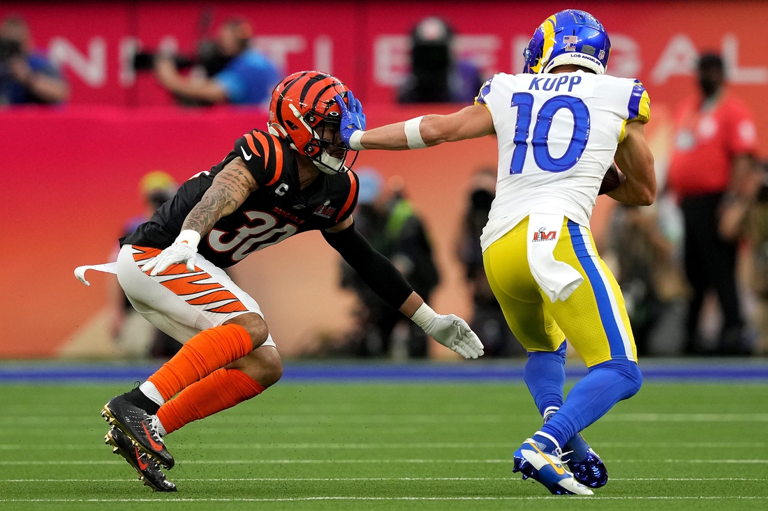 Los Angeles Rams wide receiver Cooper Kupp (10) stiff arms Cincinnati Bengals free safety Jessie Bates (30) after a catch in the first quarter during Super Bowl 56, Sunday, Feb. 13, 2022, at SoFi Stadium in Inglewood, Calif. The Cincinnati Bengals lost, 23-20.

Nfl Super Bowl 56 Los Angeles Rams Vs Cincinnati Bengals Feb 13 2022 0676