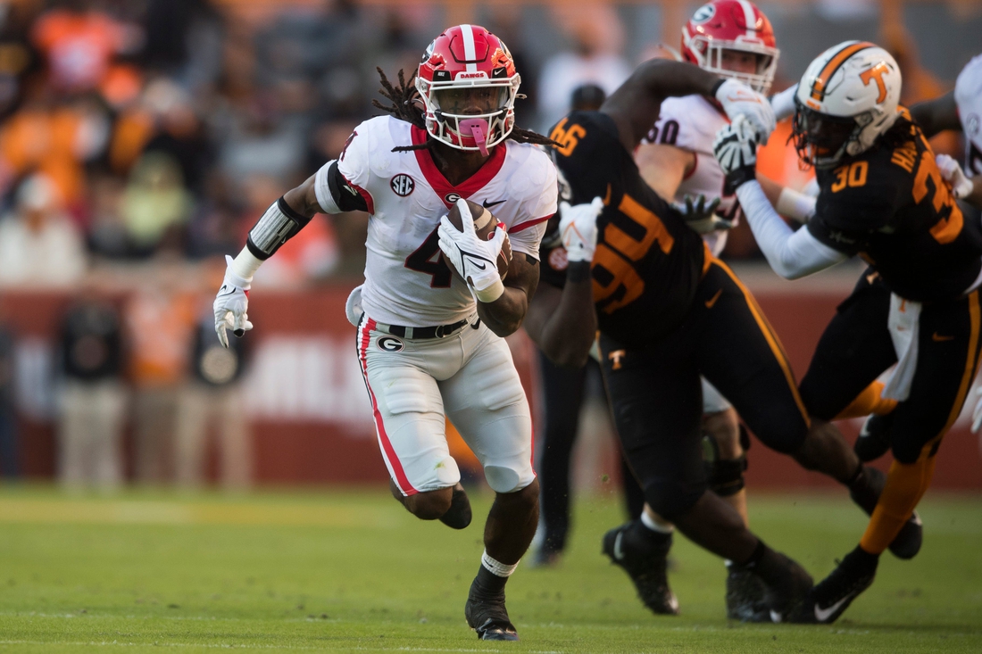 Georgia running back James Cook (4) runs the ball during an SEC football homecoming game between the Tennessee Volunteers and the Georgia Bulldogs in Neyland Stadium in Knoxville on Saturday, Nov. 13, 2021.

Tennesseegeorgia1113 1160