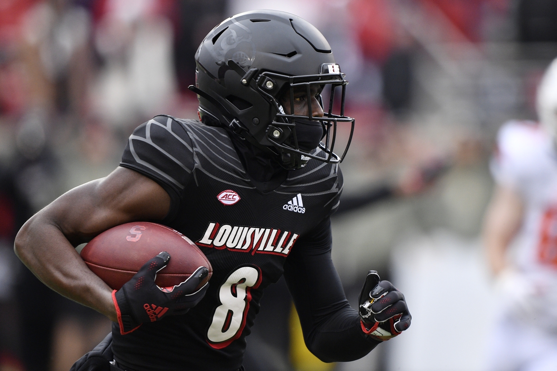 Nov 13, 2021; Louisville, Kentucky, USA;  Louisville Cardinals wide receiver Tyler Harrell (8) runs the ball against the Syracuse Orange during the first quarter  at Cardinal Stadium. Louisville defeated Syracuse 41-3. Mandatory Credit: Jamie Rhodes-USA TODAY Sports