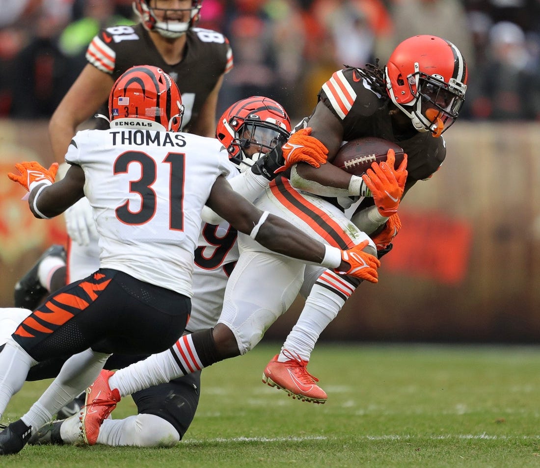 Cleveland Browns running back D'Ernest Johnson (30) rushes for a short gain during the second half of an NFL football game against the Cincinnati Bengals, Sunday, Jan. 9, 2022, in Cleveland, Ohio. [Jeff Lange/Beacon Journal]

Browns 21 1