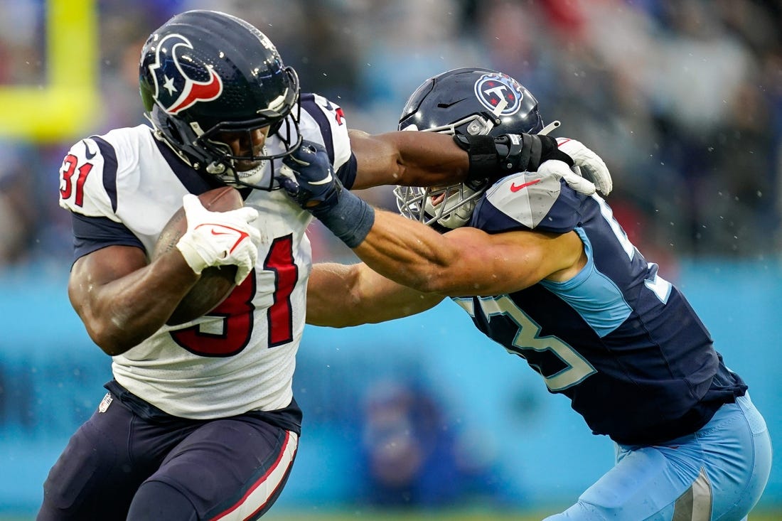 Houston Texans running back David Johnson (31) takes a hit from Tennessee Titans linebacker Dylan Cole (53) during the second quarter at Nissan Stadium in Nashville, Tenn., Sunday, Nov. 21, 2021.

Titans Texans 112121 Aan 012