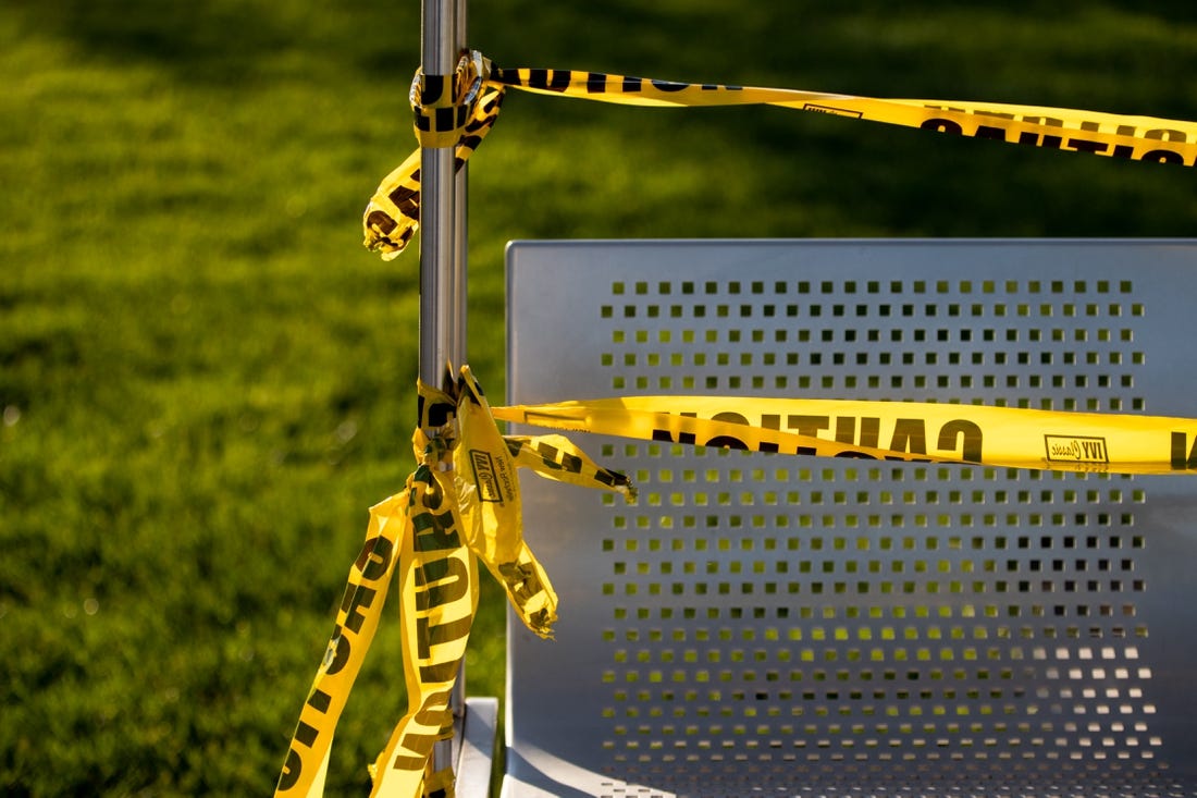 May 8, 2020; Cincinnati, OH, USA; A view of caution tape wrapped around a swing in Smale Riverfront Park in Cincinnati. Areas of the park are blocked off due to concerns of COVID-19. Mandatory Credit: Aaron Doster-USA TODAY NETWORK