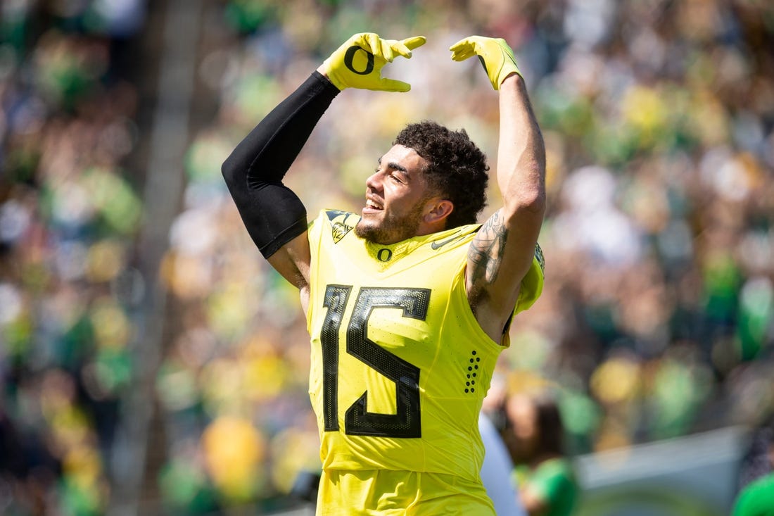Yellow Team defensive back Bennett Williams (15) dances to Shout during the Oregon Spring Game at Autzen Stadium on Saturday, April 23, 2022.