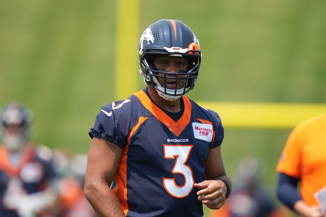 Jun 13, 2022; Englewood, CO, USA; Denver Broncos quarterback Russell Wilson (3) during mini camp drills at the UCHealth Training Center. Mandatory Credit: Ron Chenoy-USA TODAY Sports