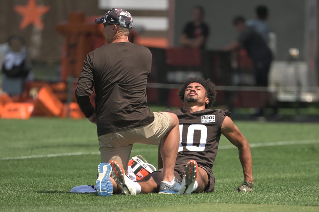 Jul 28, 2022; Berea, OH, USA; A trainer looks tends to Cleveland Browns wide receiver Anthony Schwartz (10) during training camp at CrossCountry Mortgage Campus. Mandatory Credit: Ken Blaze-USA TODAY Sports