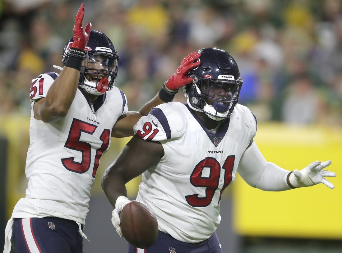 Aug 14, 2021; Green Bay, Wisconsin, USA; Houston Texans defensive tackle Jaleel Johnson (91) celebrates after a fumble recovery against the Green Bay Packers during a preseason football game at Lambeau Field. Mandatory Credit: Wm Glasheen/USA TODAY NETWORK-Wisconsin via USA TODAY NETWORK