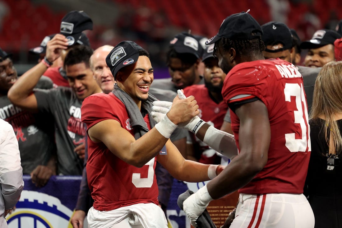 Dec 4, 2021; Atlanta, GA, USA; Alabama Crimson Tide quarterback Bryce Young (9) celebrates with linebacker Will Anderson Jr. (31) after their win during the SEC championship game after the Georgia Bulldogs at Mercedes-Benz Stadium. Mandatory Credit: Jason Getz-USA TODAY Sports