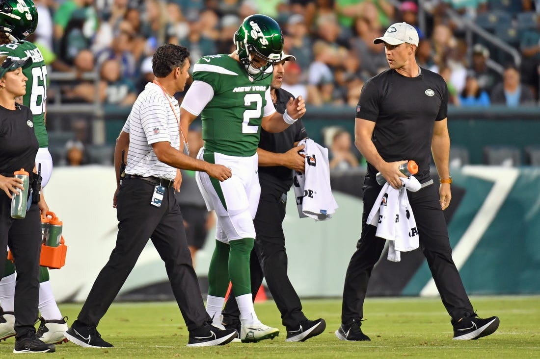 Aug 12, 2022; Philadelphia, Pennsylvania, USA; New York Jets quarterback Zach Wilson (2)  is helped off the field against the Philadelphia Eagles during the first quarter at Lincoln Financial Field. Mandatory Credit: Eric Hartline-USA TODAY Sports