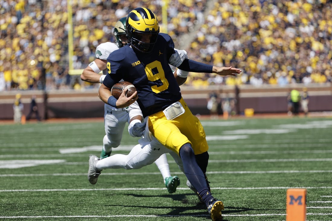Sep 3, 2022; Ann Arbor, Michigan, USA;  Michigan Wolverines quarterback J.J. McCarthy (9) rushes for a touchdown in the second half against the Colorado State Rams at Michigan Stadium. Mandatory Credit: Rick Osentoski-USA TODAY Sports