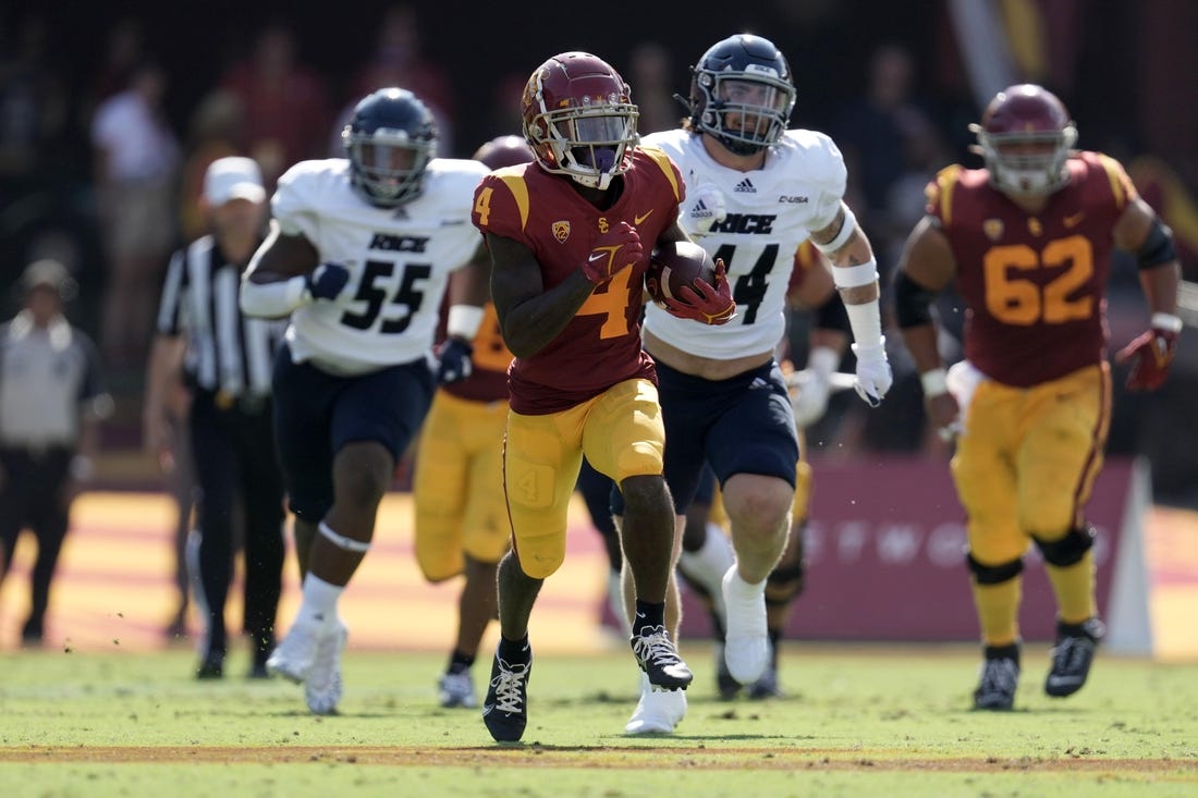 Sep 3, 2022; Los Angeles, California, USA; Southern California Trojans receiver Max Williams (4) carries the ball against the Rice Owls at United Airlines Field at Los Angeles Memorial Coliseum. Mandatory Credit: Kirby Lee-USA TODAY Sports