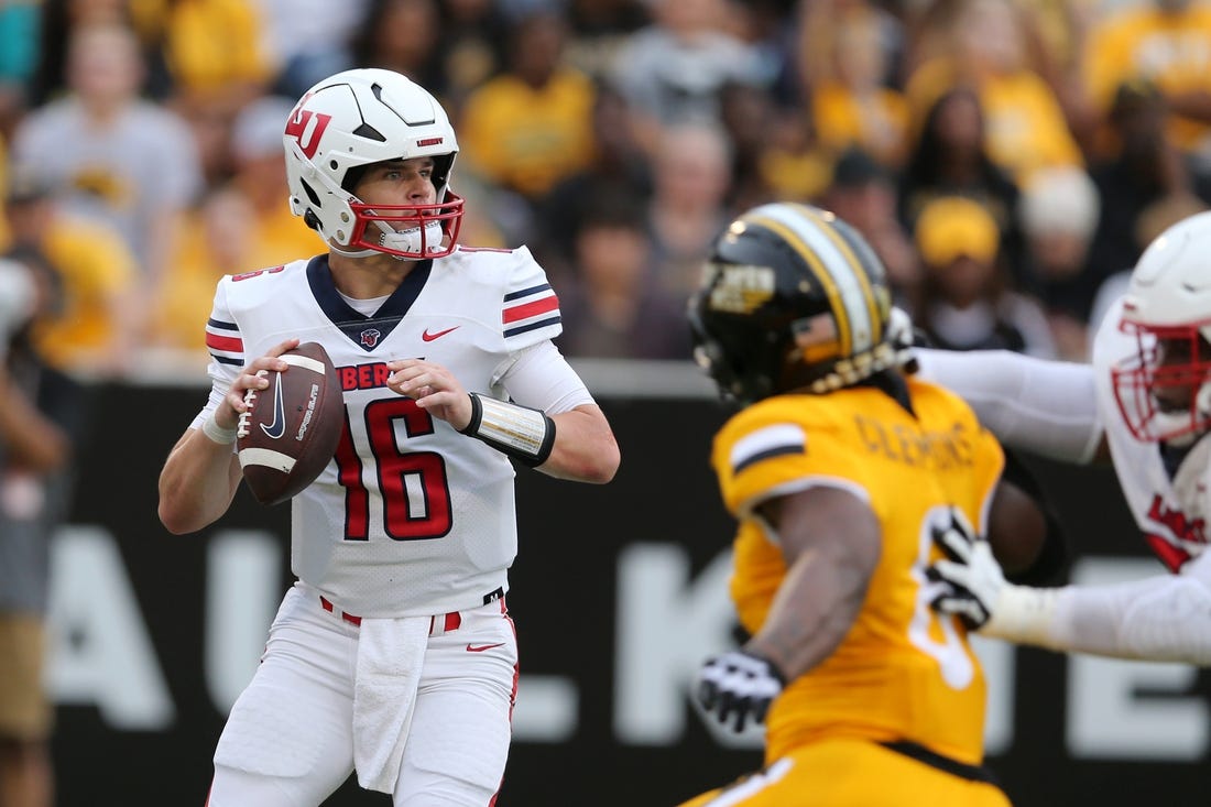 Sep 3, 2022; Hattiesburg, Mississippi, USA; Liberty Flames quarterback Charlie Brewer (16) looks to throw against the Southern Miss Golden Eagles in the first quarter at M.M. Roberts Stadium. Mandatory Credit: Chuck Cook-USA TODAY Sports