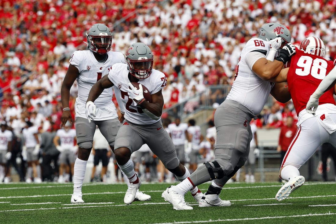 Sep 10, 2022; Madison, Wisconsin, USA;  Washington State Cougars running back Nakia Watson (25) rushes with the football during the second quarter against the Wisconsin Badgers at Camp Randall Stadium. Mandatory Credit: Jeff Hanisch-USA TODAY Sports